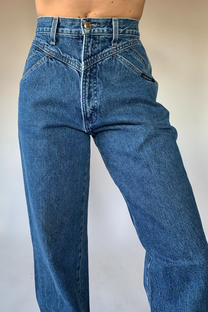 Close-up front view of Rockies high-rise wide leg jeans with V-stitch yoke detail in medium blue denim